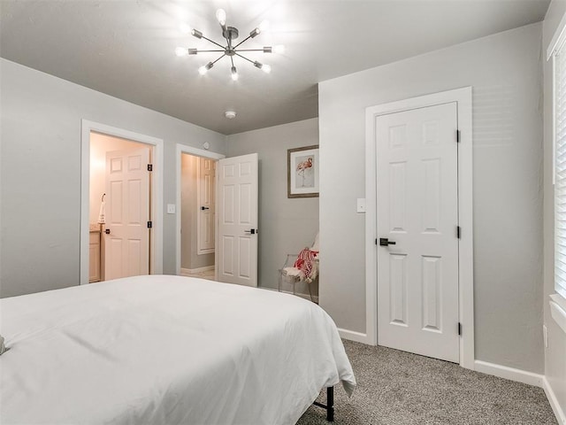 bedroom featuring carpet, an inviting chandelier, and baseboards