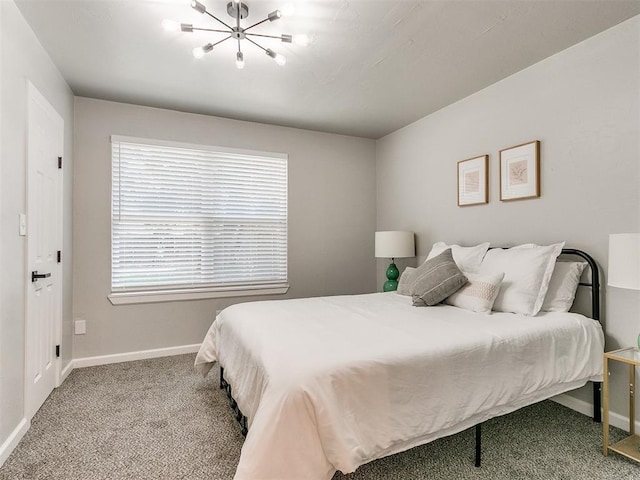 carpeted bedroom featuring baseboards