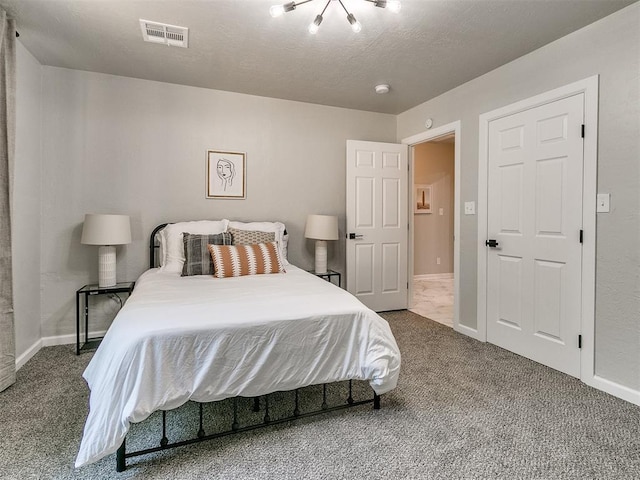 carpeted bedroom with baseboards and visible vents