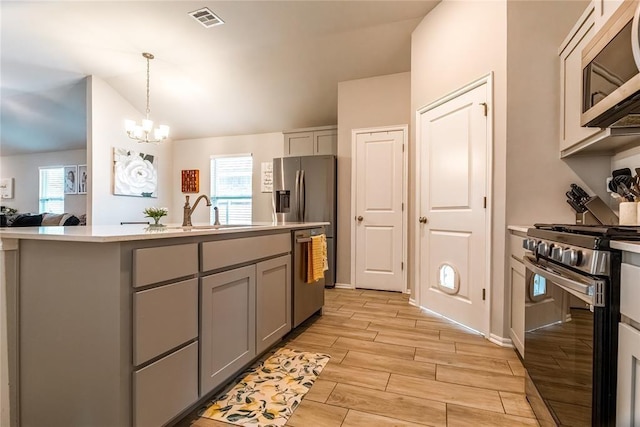 kitchen with visible vents, appliances with stainless steel finishes, light countertops, and gray cabinetry