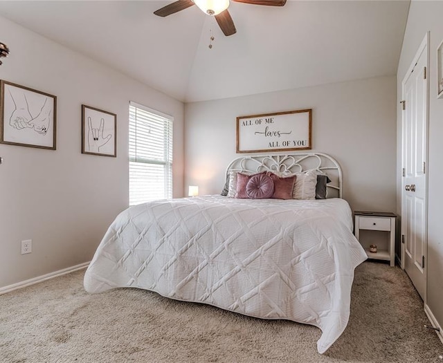 carpeted bedroom with vaulted ceiling, ceiling fan, and baseboards