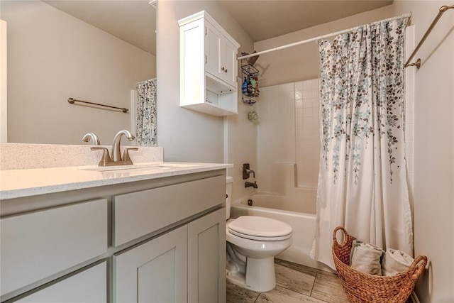 bathroom featuring shower / tub combo with curtain, vanity, and toilet