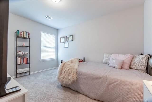 bedroom featuring baseboards, visible vents, and carpet flooring