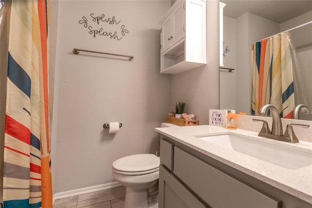 bathroom with a shower with shower curtain, vanity, toilet, and baseboards