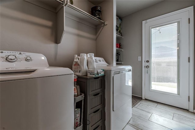 laundry area with washer and dryer and cabinet space