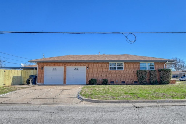 view of front facade with brick siding, a front lawn, concrete driveway, a garage, and crawl space