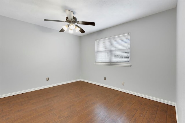 unfurnished room featuring wood-type flooring, baseboards, and a ceiling fan