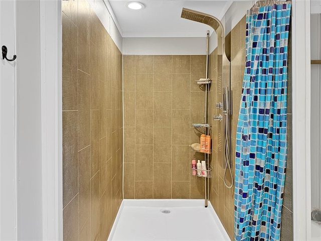 bathroom with tiled shower