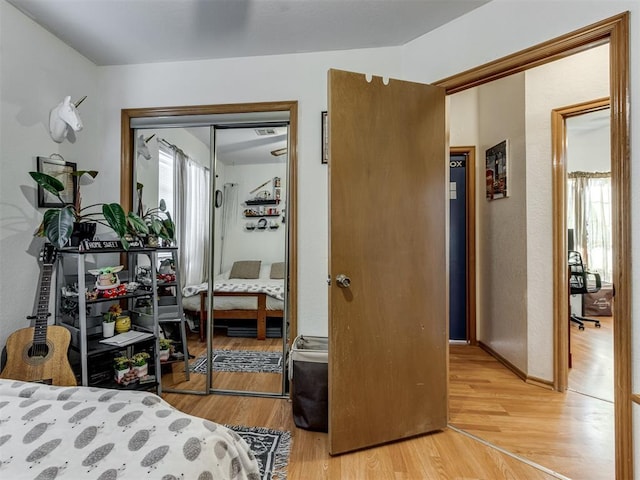 bedroom featuring light wood-style floors and a closet