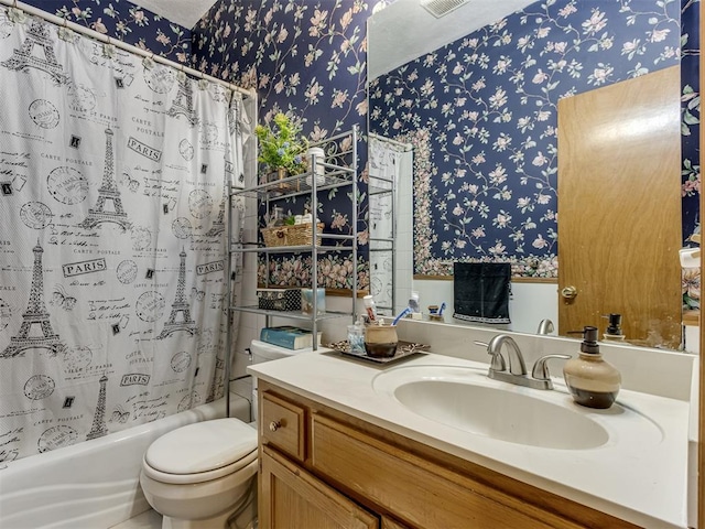 full bathroom with shower / tub combo with curtain, vanity, toilet, and wallpapered walls