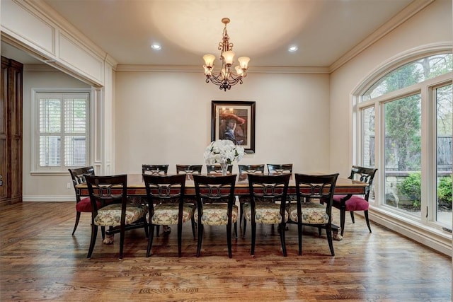 dining room featuring recessed lighting, a chandelier, crown molding, and wood finished floors