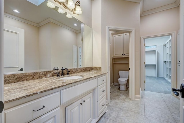 bathroom with a chandelier, toilet, vanity, ornamental molding, and tile patterned floors