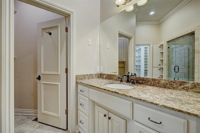 full bathroom featuring tile patterned flooring, recessed lighting, vanity, a stall shower, and crown molding