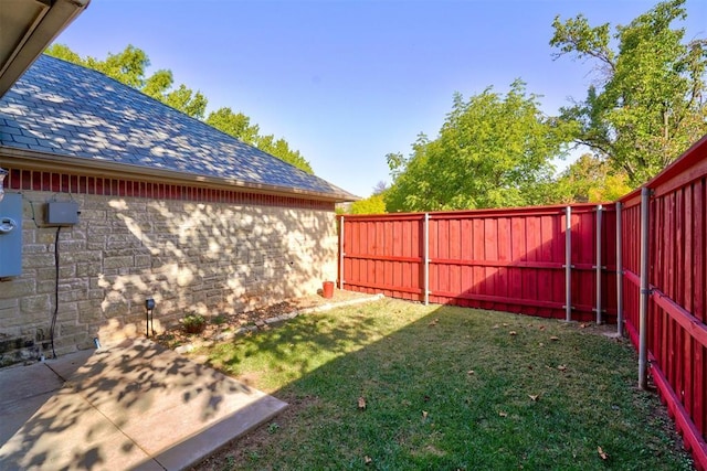 view of yard with a fenced backyard and a patio