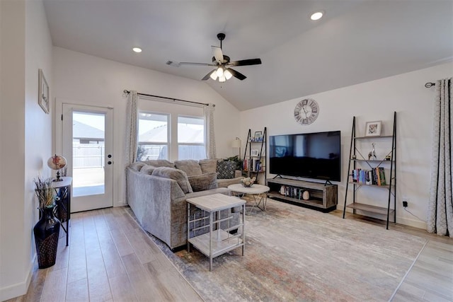 living area featuring ceiling fan, light wood-style flooring, recessed lighting, baseboards, and vaulted ceiling