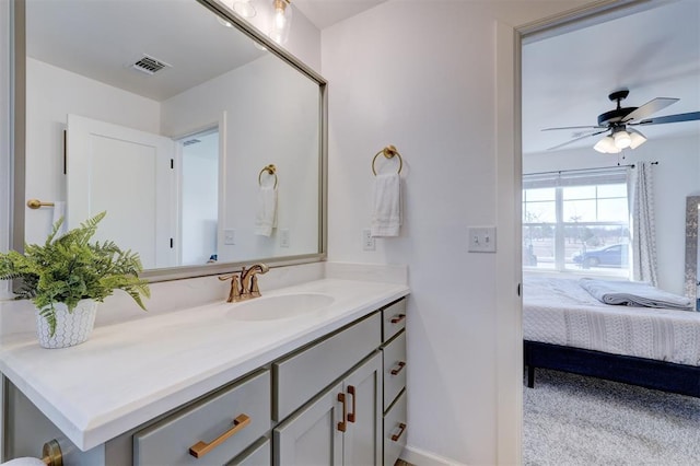 ensuite bathroom featuring ensuite bath, visible vents, a ceiling fan, and vanity