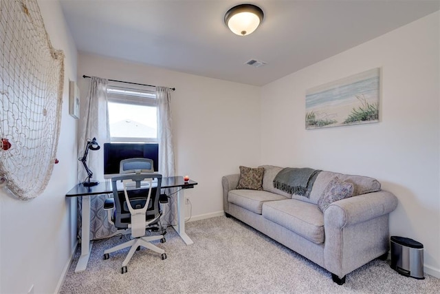 carpeted office with baseboards and visible vents