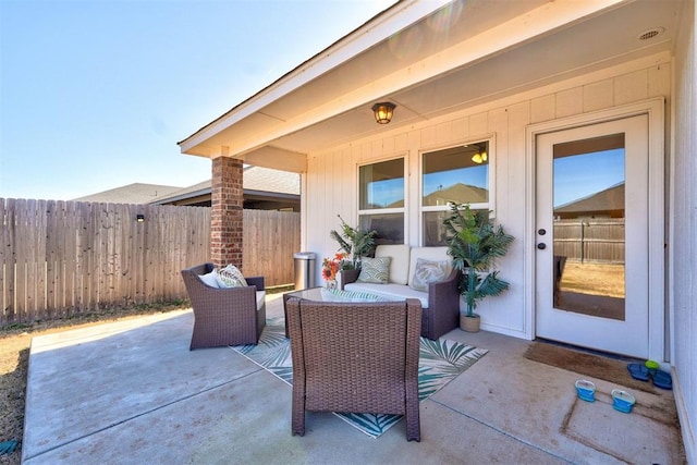 view of patio with fence and an outdoor living space