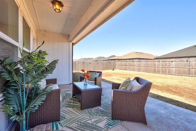 view of patio featuring a fenced backyard and an outdoor living space