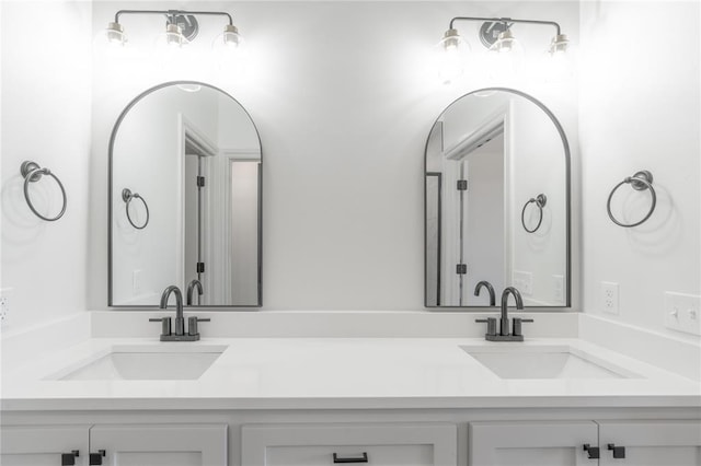 bathroom with double vanity and a sink