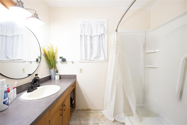 bathroom with visible vents, vanity, and a shower with curtain