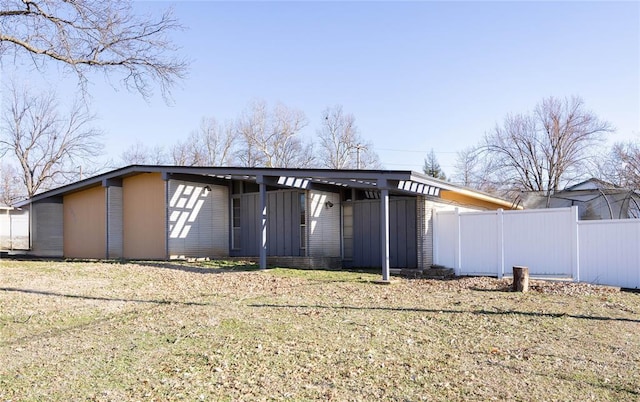 view of outbuilding featuring fence