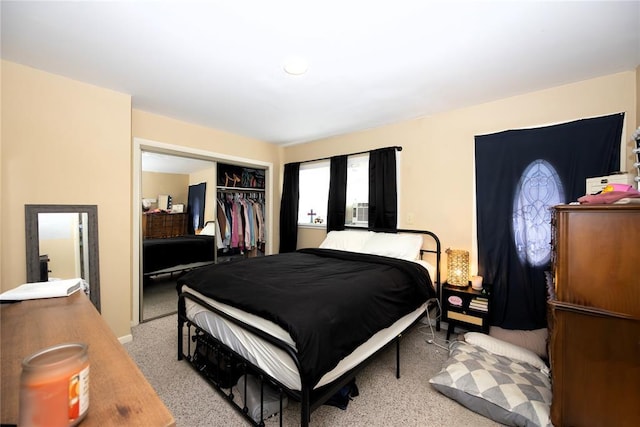 bedroom with a closet and light colored carpet