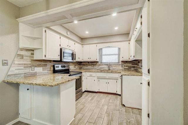 kitchen featuring light stone counters, stainless steel appliances, a peninsula, backsplash, and open shelves