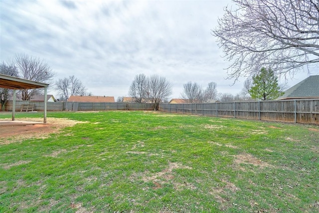 view of yard with a fenced backyard