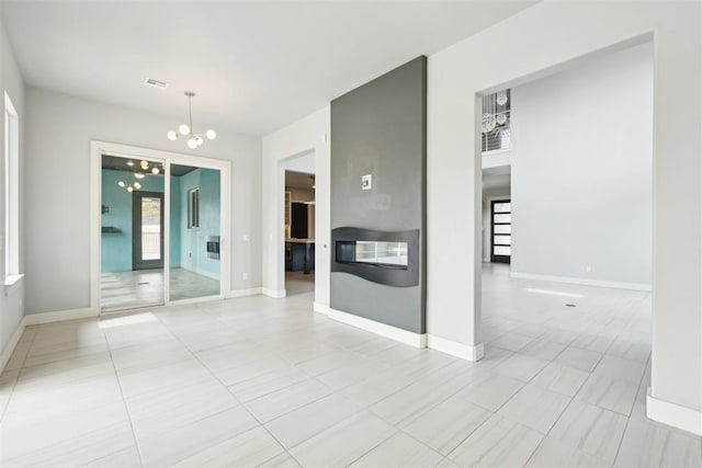 2725 Piazza Ct, Arcadia, OK 73007 - empty room with a chandelier and light tile patterned floors