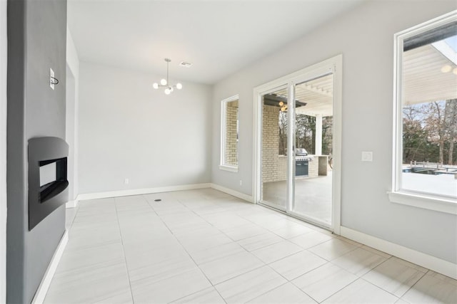 2725 Piazza Ct, Arcadia, OK 73007 - unfurnished dining area featuring plenty of natural light, a chandelier, and tile patterned floors