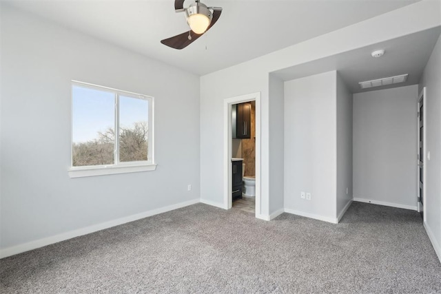 2725 Piazza Ct, Arcadia, OK 73007 - unfurnished bedroom featuring carpet, ensuite bathroom, and a ceiling fan