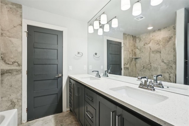 2725 Piazza Ct, Arcadia, OK 73007 - full bathroom featuring double vanity, a tub, tile walls, and a shower