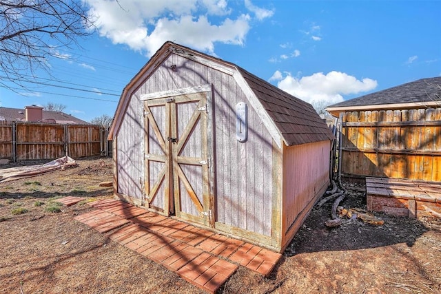 view of shed with fence