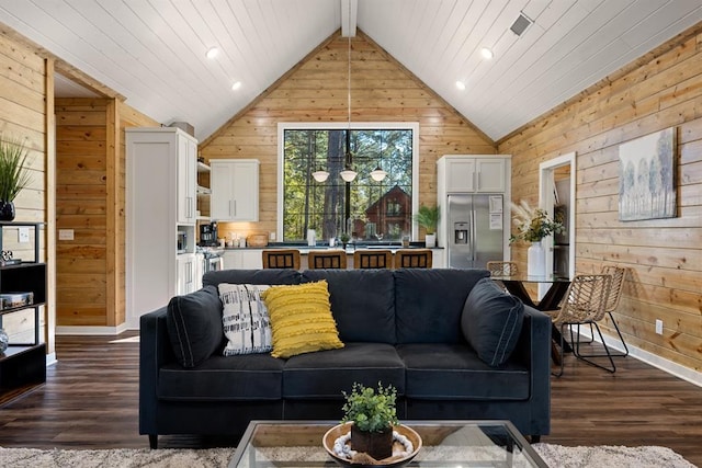 living area with vaulted ceiling with beams, dark wood-style flooring, recessed lighting, and wooden walls