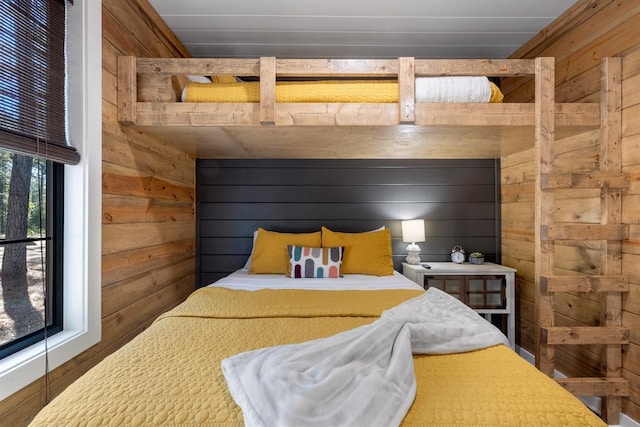 bedroom with wood walls