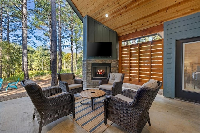 view of patio with an outdoor stone fireplace