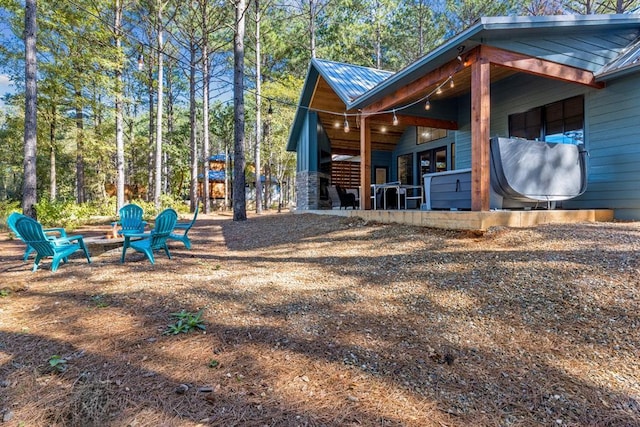 view of side of property with metal roof