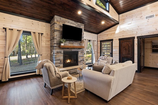 living room with wooden ceiling, wooden walls, and plenty of natural light