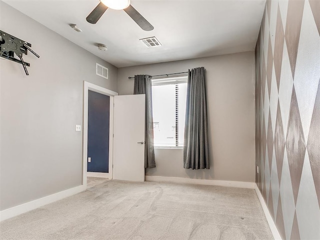 444 N Central Ave Unit 110, Oklahoma City, OK 73104 - spare room featuring carpet floors, baseboards, a smoke detector, and ceiling fan
