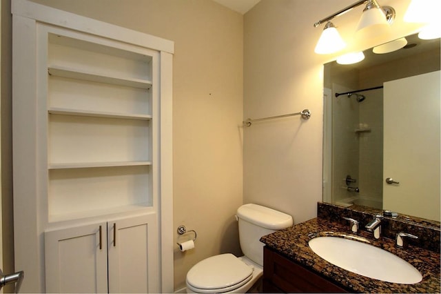 444 N Central Ave Unit 110, Oklahoma City, OK 73104 - bathroom featuring a shower, toilet, vanity, and built in shelves
