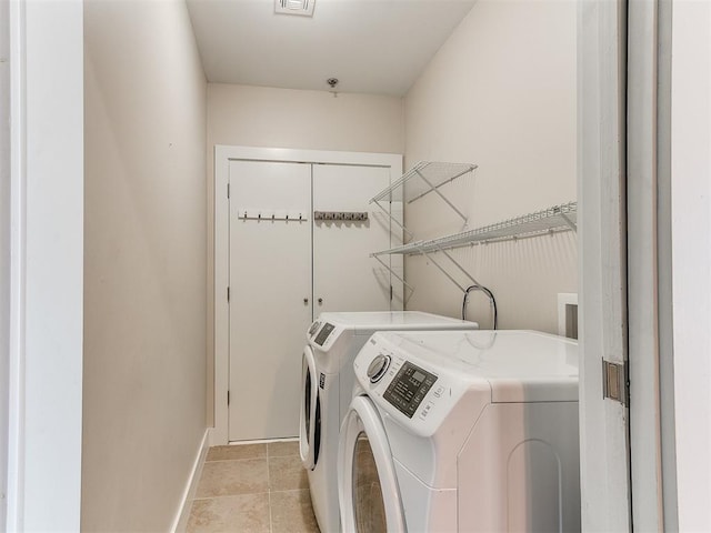 444 N Central Ave Unit 110, Oklahoma City, OK 73104 - laundry room featuring separate washer and dryer and baseboards