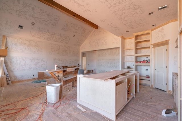 kitchen with open shelves, built in shelves, and lofted ceiling with beams