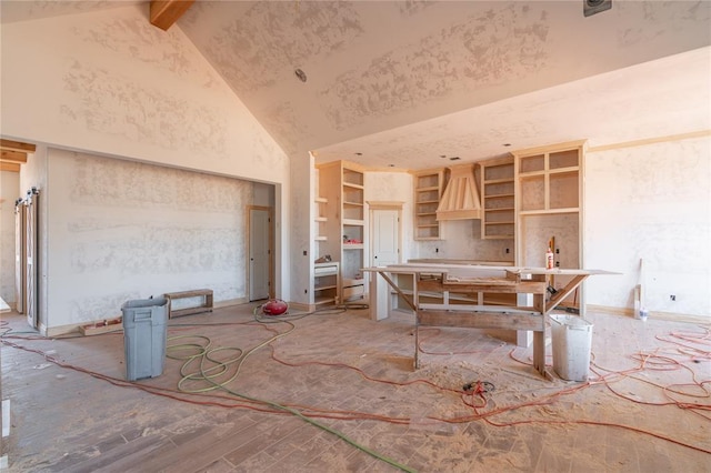 kitchen featuring open shelves, beam ceiling, and high vaulted ceiling