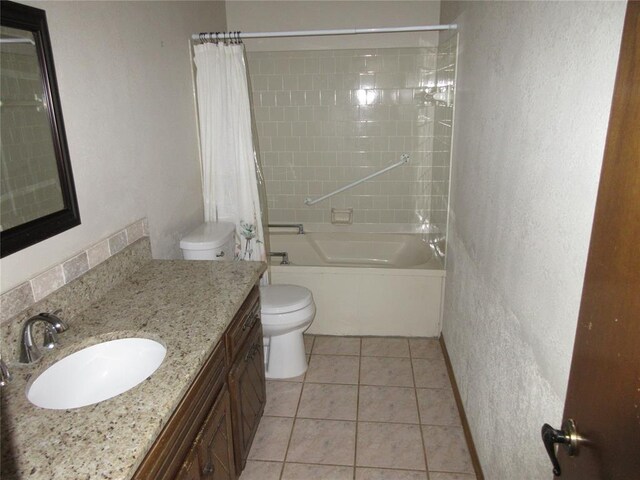 full bathroom featuring shower / tub combo, a textured wall, toilet, tile patterned floors, and vanity