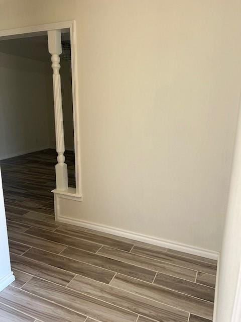 details featuring wood finish floors and baseboards