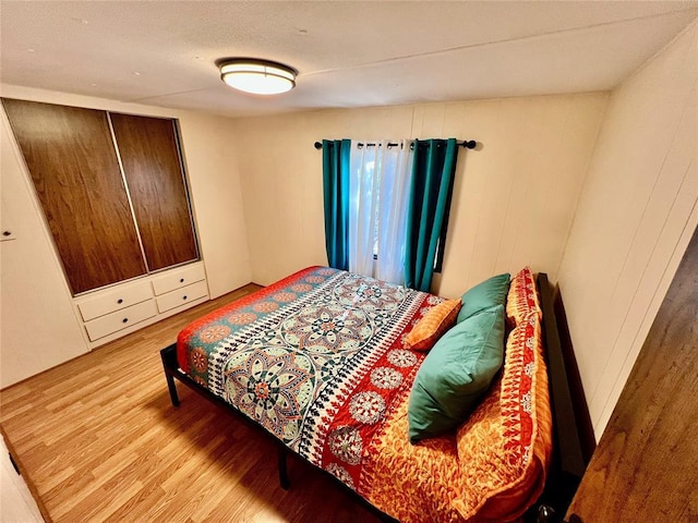 bedroom with wood finished floors