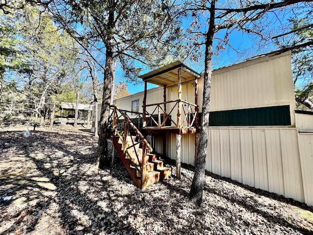 exterior space featuring stairs and a deck