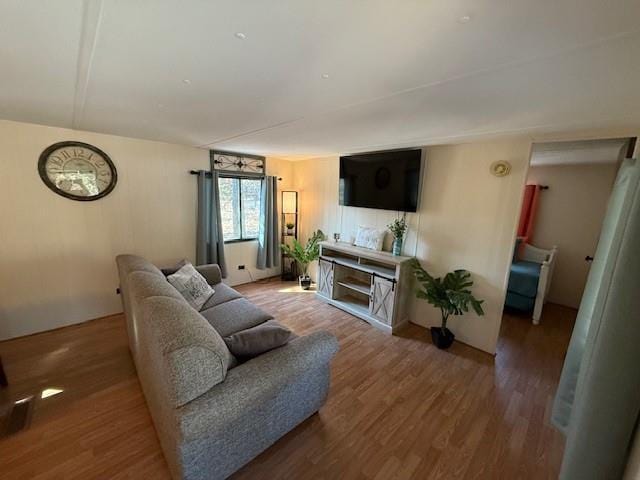 living room with wood finished floors