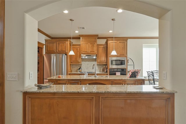 kitchen with visible vents, arched walkways, brown cabinetry, stainless steel appliances, and under cabinet range hood